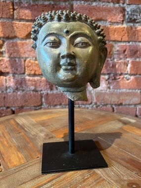 Cyan Buddha on metal stand